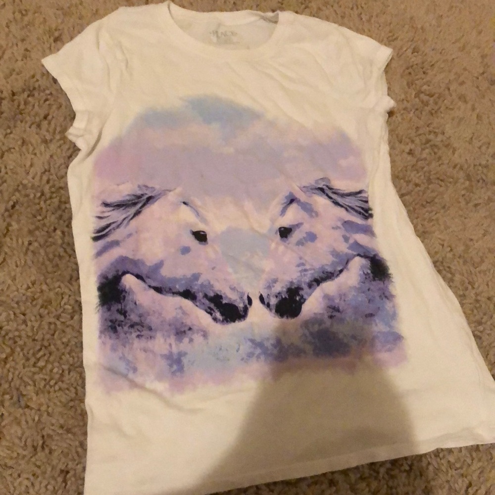 This is a 10/12 kids shirt from The Kids Place